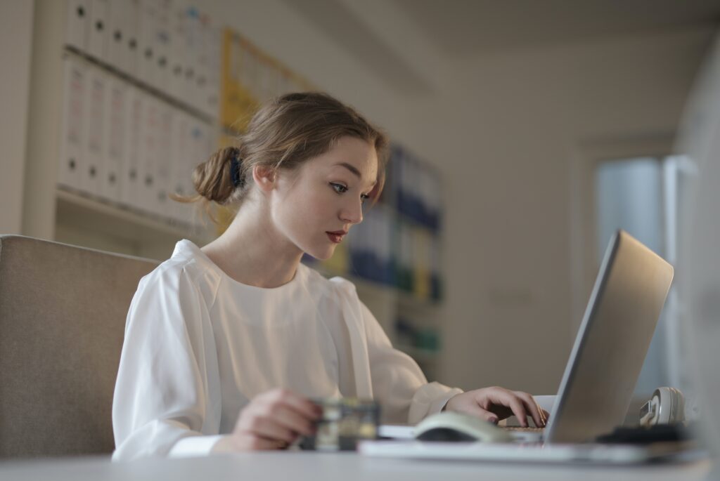 young woman using a computer in an office